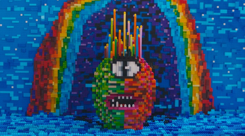 Perspective artist Alexa Meade creates 12,000-piece LEGO rainbow alien