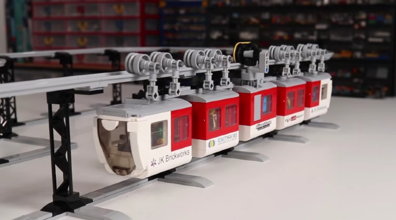 This suspended, motorised LEGO train is only six studs wide